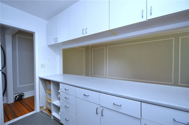 walk in closet featuring dark wood-type flooring