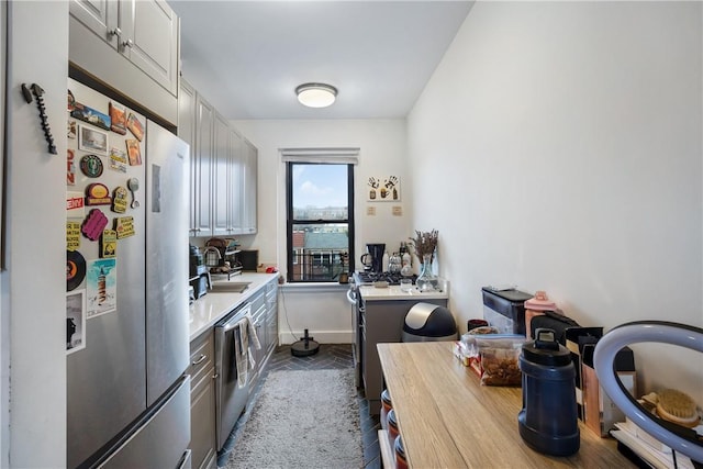 2115 33rd St Unit 4E, Astoria, NY 11105 - kitchen featuring stainless steel appliances, light countertops, and gray cabinets