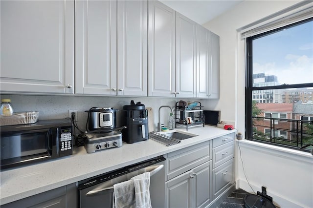 2115 33rd St Unit 4E, Astoria, NY 11105 - kitchen featuring dishwasher, black microwave, white cabinets, and light stone counters
