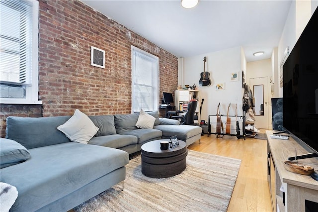 2115 33rd St Unit 4E, Astoria, NY 11105 - living room with brick wall and wood finished floors