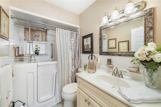 bathroom featuring a shower with curtain, vanity, toilet, and tile walls