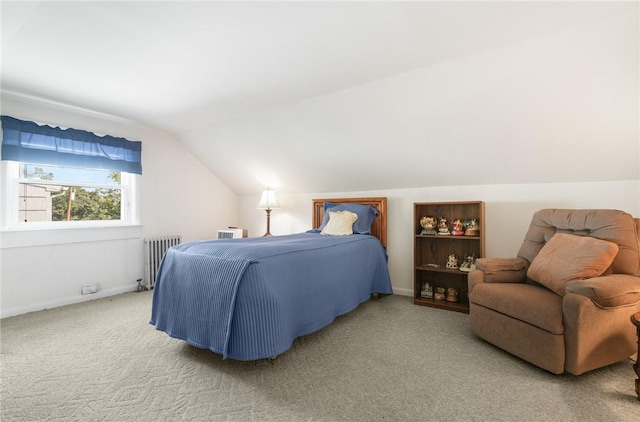 carpeted bedroom featuring vaulted ceiling and radiator