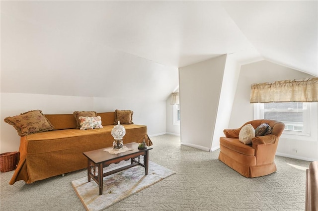 living room featuring carpet and lofted ceiling