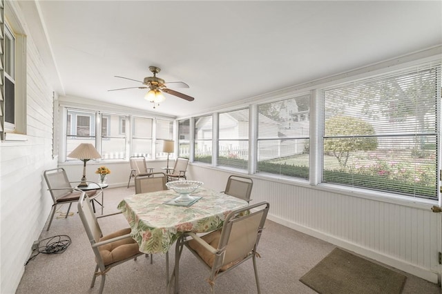 sunroom featuring ceiling fan