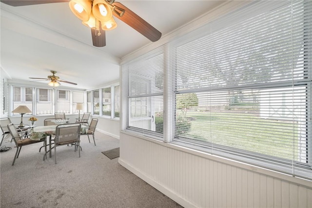 sunroom featuring ceiling fan