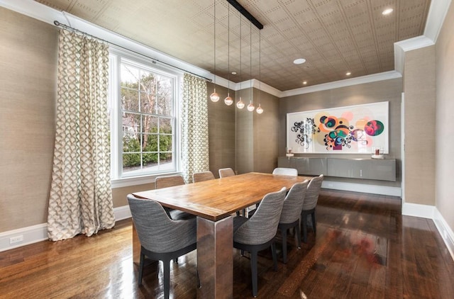 dining space with ornamental molding and dark hardwood / wood-style flooring