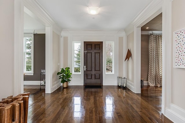 entrance foyer with crown molding and dark hardwood / wood-style flooring