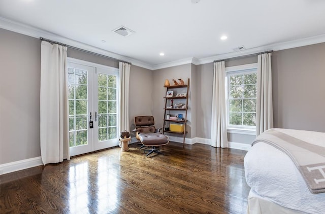 bedroom featuring ornamental molding, access to exterior, dark hardwood / wood-style flooring, and french doors