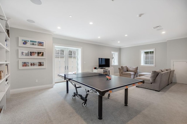 game room featuring crown molding, light colored carpet, and french doors