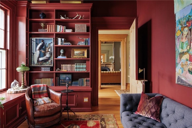 living area with light wood-type flooring and a wealth of natural light