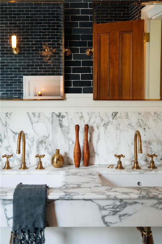 room details featuring backsplash and sink