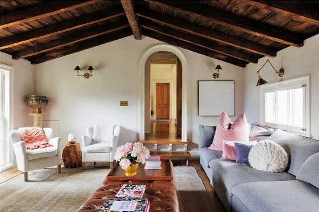 living room with wood ceiling, vaulted ceiling with beams, and light hardwood / wood-style floors