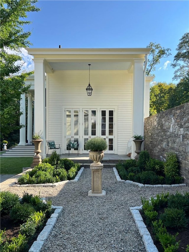 view of exterior entry featuring a porch