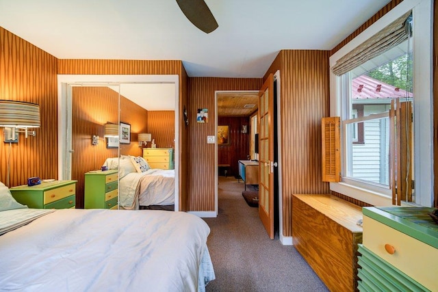 bedroom with ceiling fan, a closet, and carpet