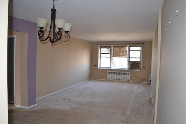 carpeted spare room with cooling unit, radiator, and an inviting chandelier