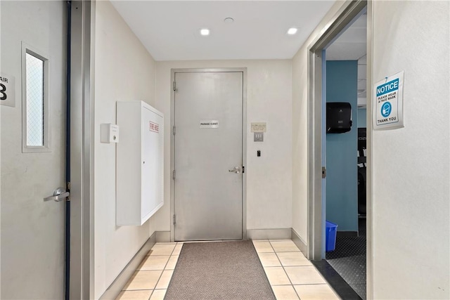 doorway to outside featuring light tile patterned floors