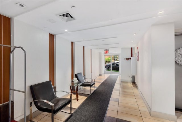 hall featuring light tile patterned floors