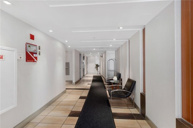 hallway featuring light tile patterned floors