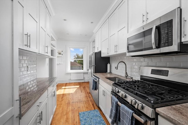 kitchen with white cabinetry and appliances with stainless steel finishes