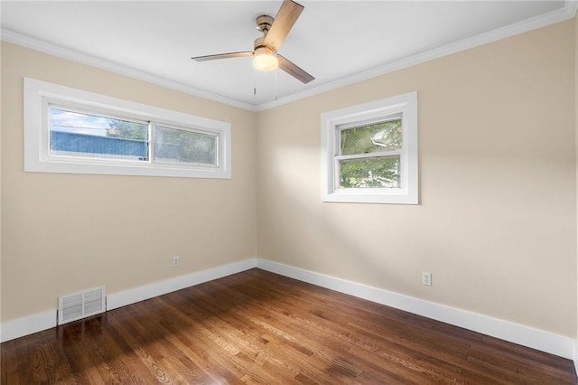 unfurnished room featuring hardwood / wood-style floors, ceiling fan, and crown molding