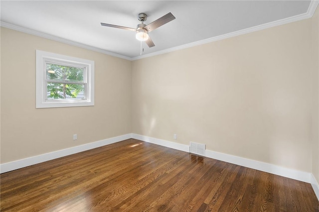 unfurnished room featuring dark hardwood / wood-style floors, ceiling fan, and crown molding