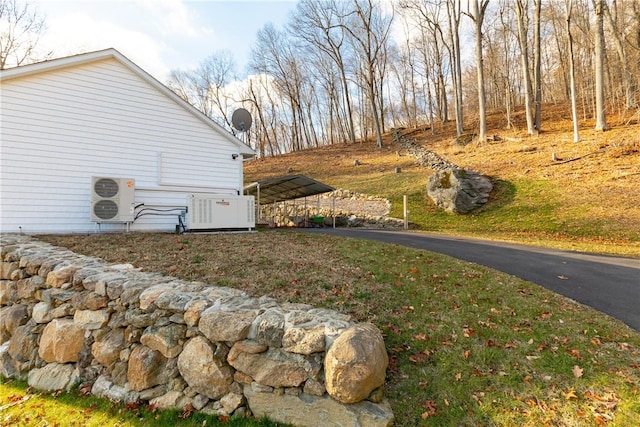 view of home's exterior with ac unit