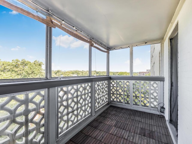 unfurnished sunroom with plenty of natural light