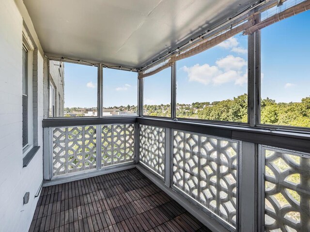 unfurnished sunroom with a healthy amount of sunlight