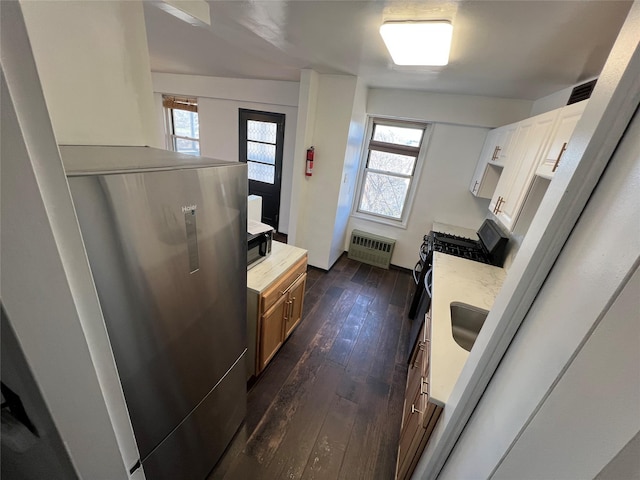 1200 Midland Ave Unit 10F, Bronxville, NY 10708 - kitchen featuring black gas stove and dark wood finished floors