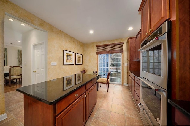 kitchen featuring stainless steel double oven and a center island