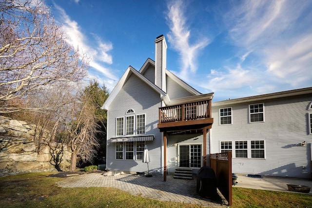 back of property featuring a patio area