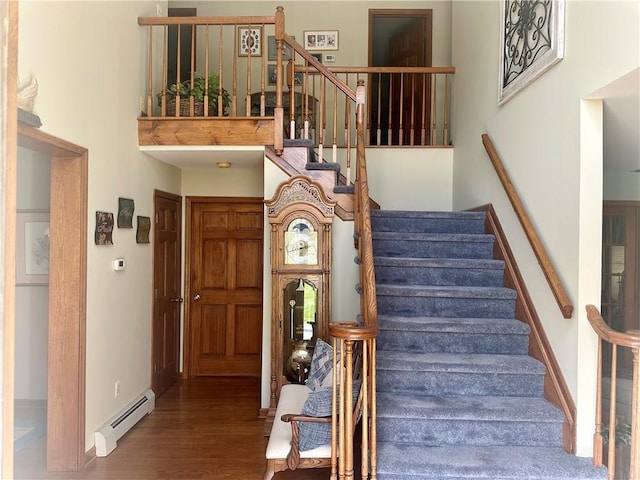 98 Pelham Dr, Cornwall, NY 12518 - stairway with baseboards, wood finished floors, and a baseboard radiator