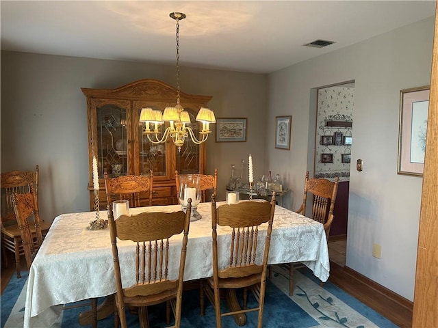 98 Pelham Dr, Cornwall, NY 12518 - dining area with an inviting chandelier, baseboards, wood finished floors, and visible vents