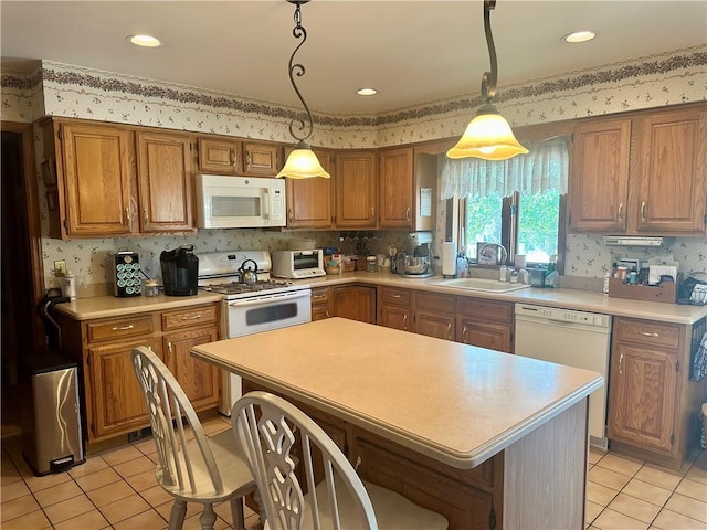 98 Pelham Dr, Cornwall, NY 12518 - kitchen with light tile patterned floors, light countertops, white appliances, and a sink