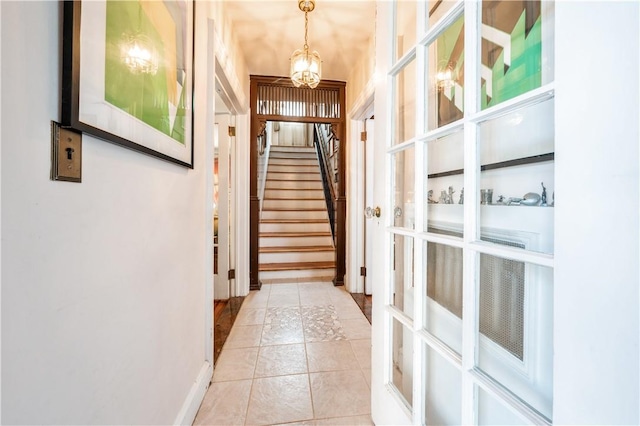 doorway featuring an inviting chandelier