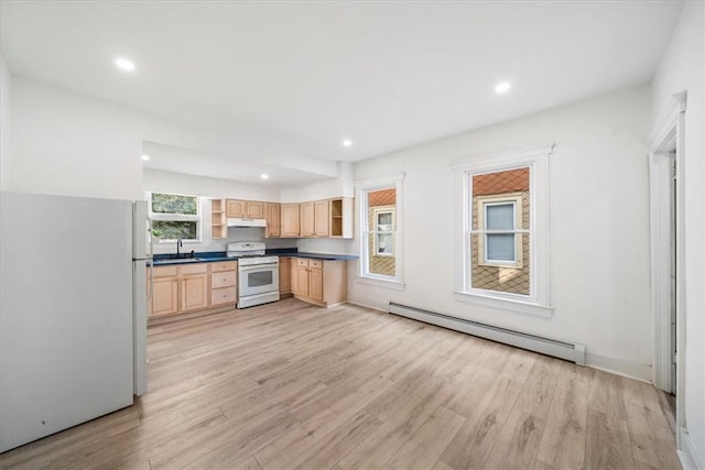 kitchen with light brown cabinetry, light wood-type flooring, white appliances, baseboard heating, and sink