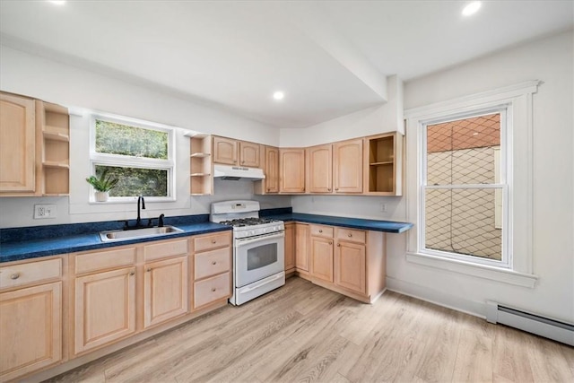 kitchen featuring light brown cabinets, sink, a baseboard radiator, white gas stove, and light hardwood / wood-style floors