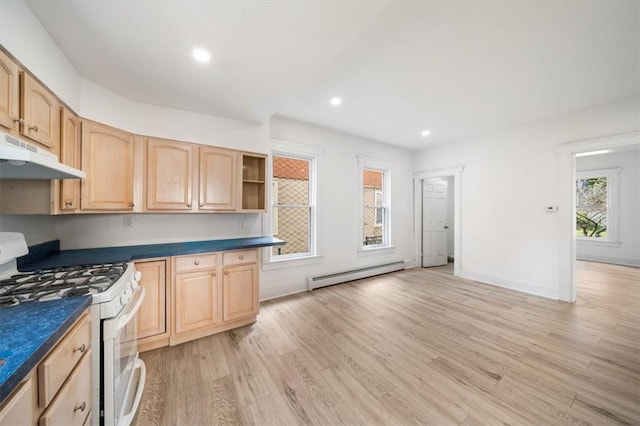 kitchen featuring light brown cabinets, light hardwood / wood-style floors, baseboard heating, and white gas range