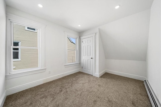 bonus room with carpet, a baseboard radiator, and vaulted ceiling