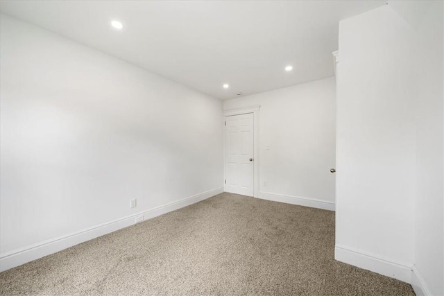 unfurnished room featuring carpet