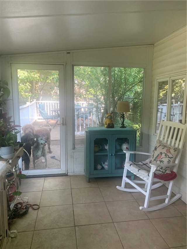 sunroom featuring vaulted ceiling