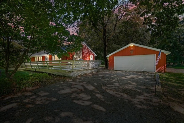 exterior space with an outdoor structure and a garage