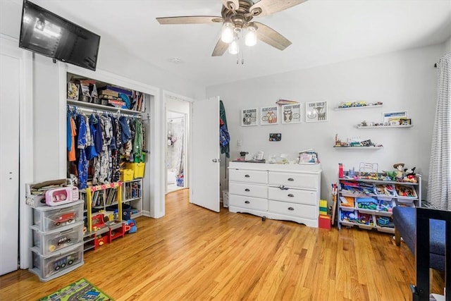 rec room featuring ceiling fan and light wood-type flooring