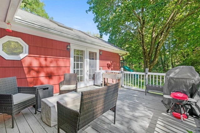 wooden terrace featuring grilling area