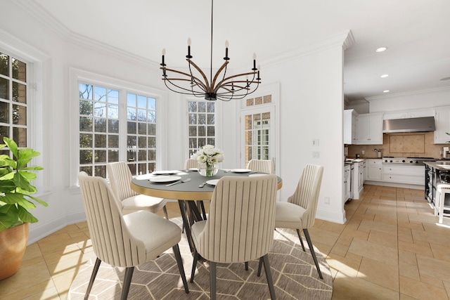 dining area with a chandelier, recessed lighting, baseboards, and crown molding