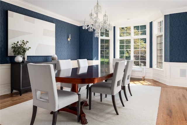 778 Sleepy Hollow Rd, Briarcliff Manor, NY 10510 - dining space with a chandelier, light wood finished floors, crown molding, a wainscoted wall, and wallpapered walls