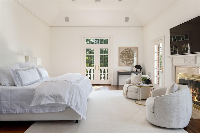 778 Sleepy Hollow Rd, Briarcliff Manor, NY 10510 - bedroom with french doors, access to exterior, a glass covered fireplace, a raised ceiling, and wood finished floors