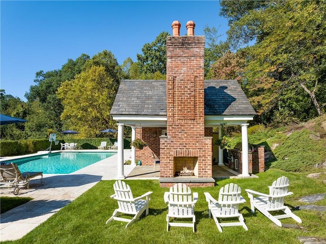778 Sleepy Hollow Rd, Briarcliff Manor, NY 10510 - outdoor pool featuring an outdoor brick fireplace, a patio, and a lawn