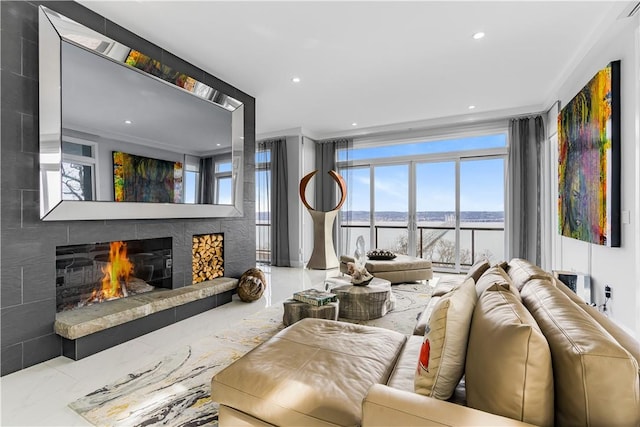 living room with a fireplace and ornamental molding