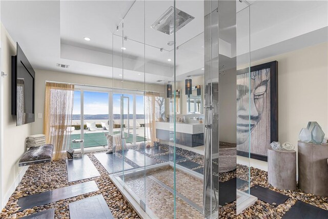 bathroom featuring a raised ceiling